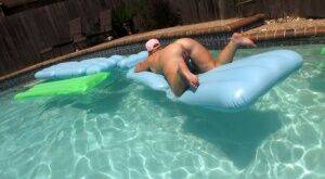 Fat amateur Dee Siren masturbates on an air mattress in a swimming pool on nudesceleb.com