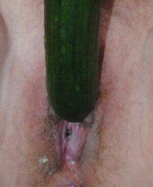 Mature platinum blonde Dimonty masturbates with a banana and a cucumber on nudesceleb.com