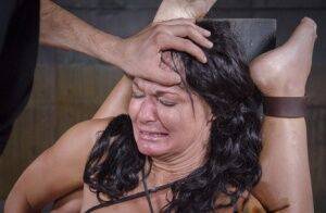Brunette female London River is totally helpless during an intense BDSM fuck on nudesceleb.com