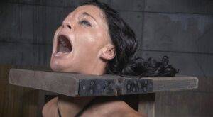 Restrained brunette London River is forced to suck a black penis on nudesceleb.com