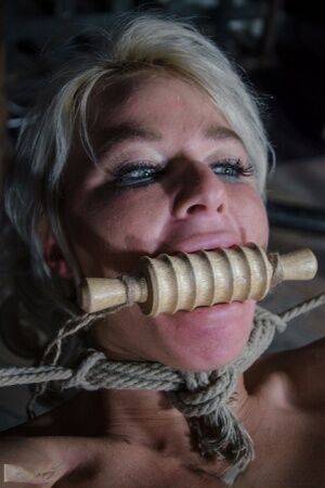 Platinum blonde London River is gagged and tied up in a dungeon on nudesceleb.com