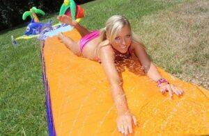 Young blonde Ally Kay ends a water fight by having sex in backyard on nudesceleb.com