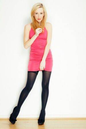 Blonde girl Sophia Smith exposes lace panties before posing nude in hosiery on nudesceleb.com