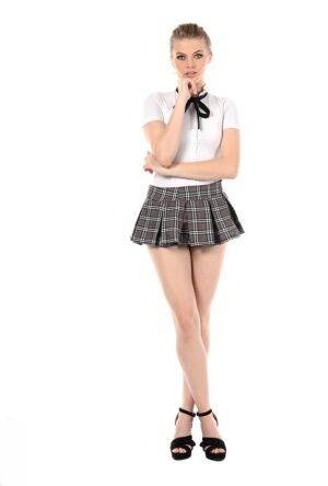 Leggy girl Sophie Sparks peels off her school uniform to masturbate on nudesceleb.com