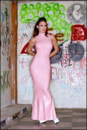 Latina beauty Ryan Keely inserts a vibrator after removing a long latex dress on nudesceleb.com