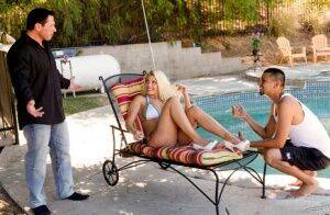 Hot blonde Britney Amber sports red lips while having sex next to a pool on nudesceleb.com