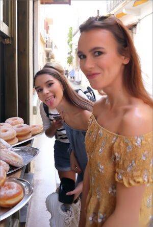 Leggy girls stumble across a donut stand while doing touristy things on nudesceleb.com