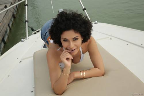 Curly-haired Beauty With Big Natural Tits Gets Sodomized On Yacht on nudesceleb.com