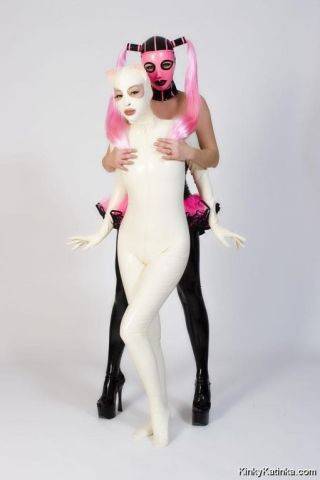 Two babes wearing kinky latex outfits on nudesceleb.com