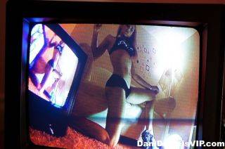 Dani daniels posing and watching herself on video on nudesceleb.com
