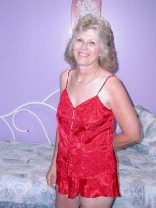 Classy granny in sexy red lingerie spreads hairy pussy on cam on nudesceleb.com