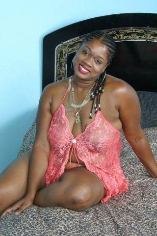 Busty fat ebony getting nasty on couch and playing red dildo on nudesceleb.com