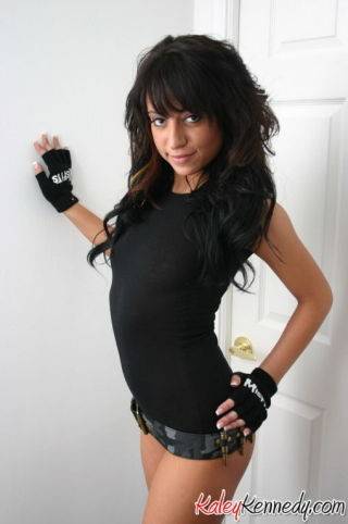 Kaley shows off her bullet belt on nudesceleb.com