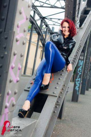 Redhead in shiny latex on nudesceleb.com