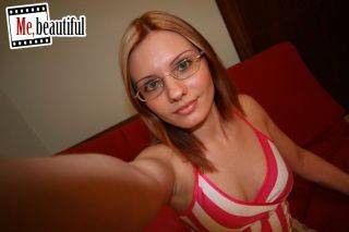 Hottie in glasses takes nasty photos of her bubbies and spread twat on nudesceleb.com