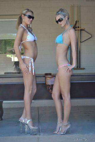 Busty blonde amateur babes in bikinis strip otudoors on nudesceleb.com