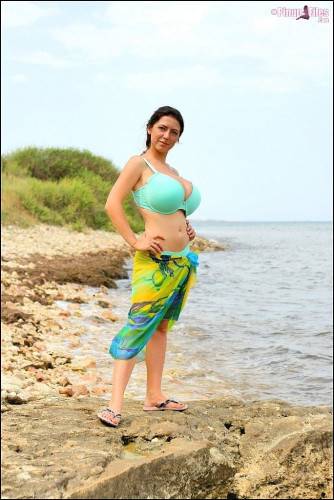 Excellent ukrainian brunette milf Merilyn Sakova revealing big titties and butt on the beach - Ukraine on nudesceleb.com
