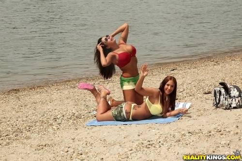 Hot girls Kyra Hot and Candi Coxx enjoy a lesbian foreplay at beach on nudesceleb.com