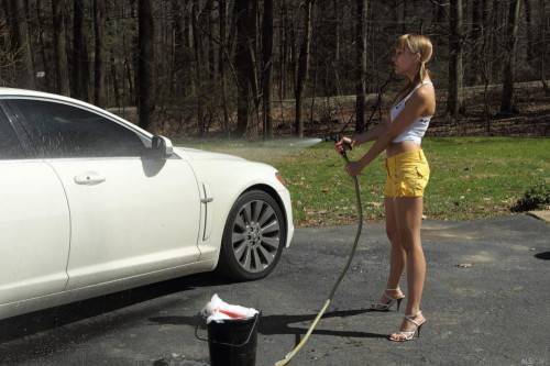 Charming Whore Blue Angel Is Stripping And Masturbating Nub With Shlong Instead Of Car Washing on nudesceleb.com