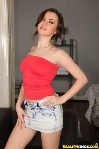 Charming hottie Angela in fancy skirt showing big boobies and sexy ass on nudesceleb.com