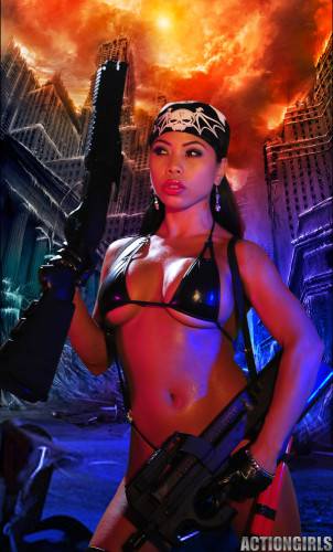 Exotic Action Babe With Gun Genevive Valente Poses In Black Bikini And Bandanna on nudesceleb.com