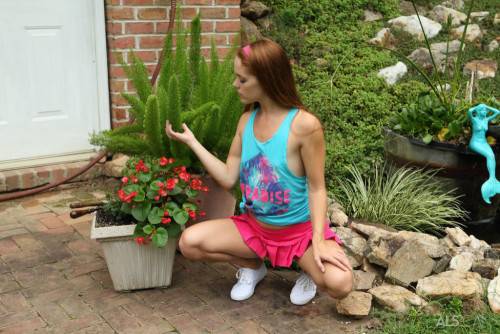 Hot redhead teen Kymberly Brix in sexy skirt exhibits tiny tits and toys her cunt outdoor on nudesceleb.com