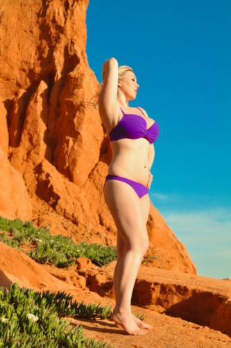 Erotic Lilac Bikini Is Falling Down To The Feet Of Busty Lyla Ashby Posing Outdoor on nudesceleb.com