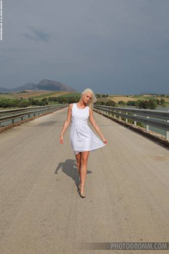Playful Hot Blonde Grace Photodroom Takes Her Clothes Off In The Middle Of The Road on nudesceleb.com