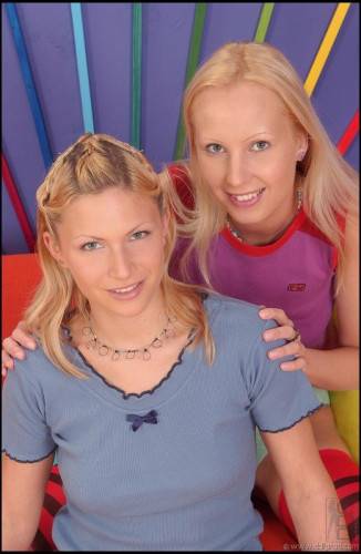 Dishy Kathy Blanche And Her Lesbian Friend Both In Striped Stockings Licking Multicolor Toys on nudesceleb.com