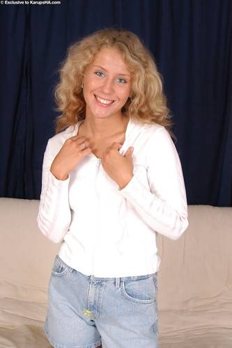 Sylphlike blond teen Lita in fancy shorts revealing her butt and vagina on nudesceleb.com