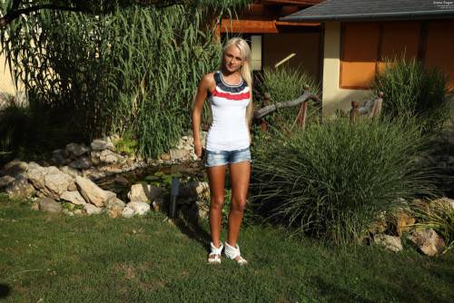 Shaved And Tanned Blonde Ivana Sugar Poses Outside And Shows Us Her Delicate Snatch on nudesceleb.com