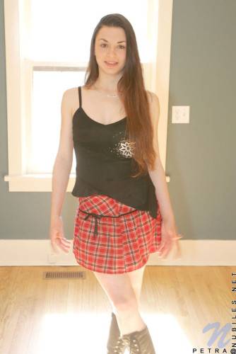 Shedding Her School Girl Uniform Petra Nubiles Exhibits Her Lean And Tight Body With Long Hair on nudesceleb.com