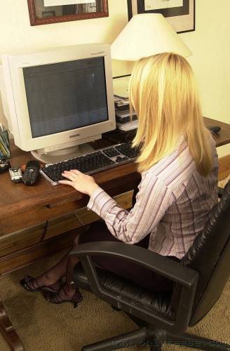 Blonde Haired Office Lady Abigail Strips And Proves That She Looks Fine In Nylons And Garters on nudesceleb.com