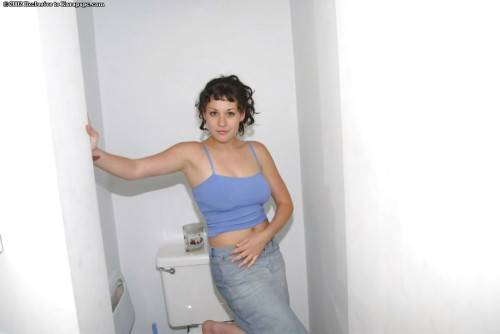 Very attractive brunette teen Bunny in sexy panties baring big boobs and spreading her legs in the bathroom on nudesceleb.com