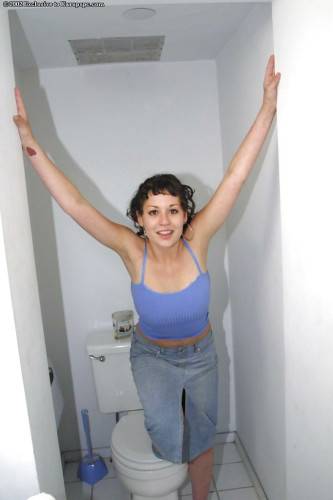 Foxy youthful Bunny reveals big knockers and spreads her legs in the bathroom on nudesceleb.com
