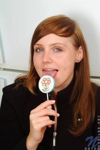 Red Haired Teen Babe Beth Nubiles Slowly Strips While Eating A Lollipop. on nudesceleb.com
