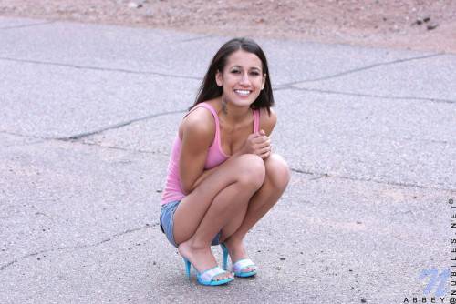 Frisky Teen Chic Amia Moretti Pulls Down Her Blue Shorts And Pink Panties Outdoors on nudesceleb.com