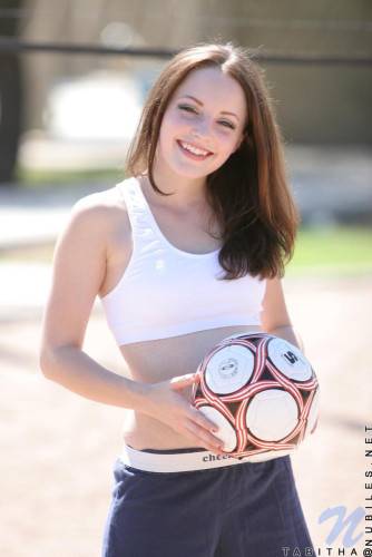 Smiling Sportive Girl Tabitha Nubiles In Snow White Top And Blue Shorts Poses With A Ball Outside on nudesceleb.com