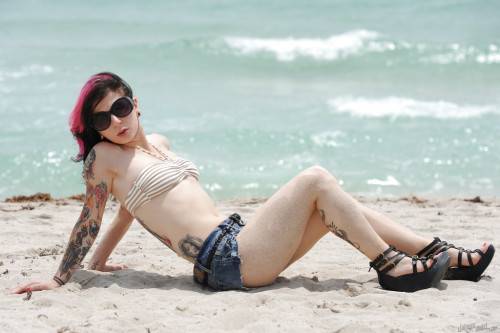 Hot american cutie Joanna Angel uncovering small tits and sexy butt on the beach - Usa on nudesceleb.com