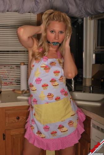 Gagged Bimbo Rachel Sexton Is Fooling Around In Dress And Half Nude In The Kitchen on nudesceleb.com