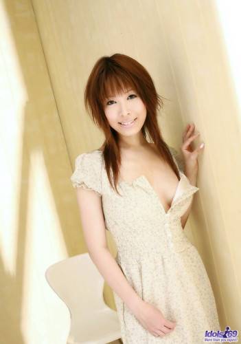 Naked Asian Bimbo Shizuku Natsukawa Is Sitting Before Camera And Smiling To Us on nudesceleb.com