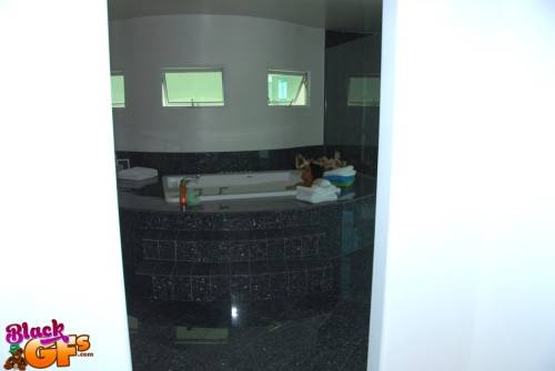 Curious black amateur Khloe Rain exposing her butt and spreading her legs in bath on nudesceleb.com