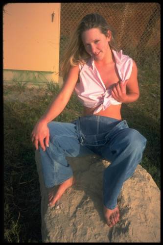 Shaved Pussy Chick Alexis Malone In Jeans And Thong Does Striptease In The Field on nudesceleb.com