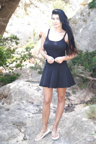 Inviting czech brunette Lucy Li in skirt showing big knockers and hairy beaver outside - Czech Republic on nudesceleb.com