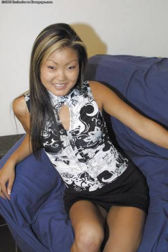 Hot asian teen Lucylee in nice skirt exhibits small tits and shaved pussy on nudesceleb.com