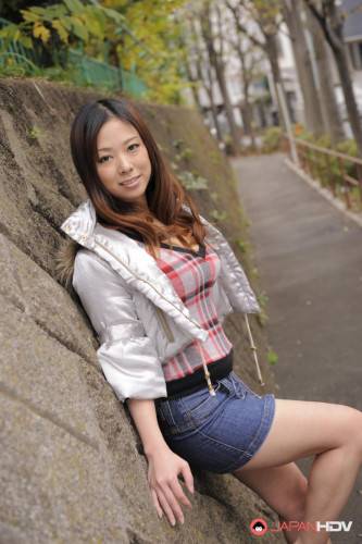 Asian Chick In A Short Jeans Skirt Asuka Is Sexily Posing In The Autumn City on nudesceleb.com