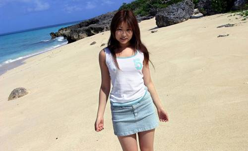 Girl Miyu Sugiura Is On The Beach Showing Off The Delicious Looking Thong Up The Skirt on nudesceleb.com