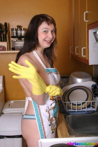 Busty brunette teen abrianna teasing in the kitchen on nudesceleb.com