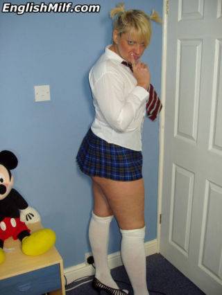 Curvy mom teasing in her schoolgirl outfit - Britain on nudesceleb.com