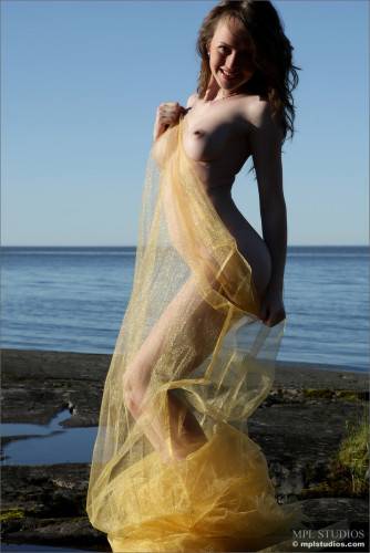 Alluring Babe Nastya E Uses Her Yellow Veil To Tease By The River Without Anything On on nudesceleb.com